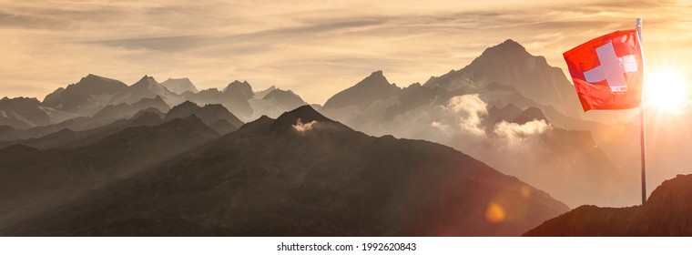 Swiss Flag In Swiss Mountains