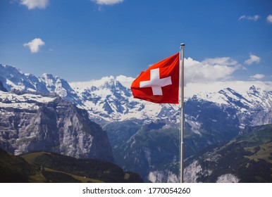 swiss flag on montain top near jungfraujoch (the top of Europe)