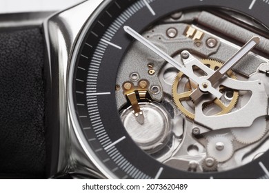 Swiss Made Quartz Skeleton Wrist Watch, Black Deal And Hands. Close-up Photo. It Is A Watch Type In Which All Of The Moving Parts Are Visible