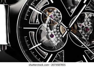 Swiss Mechanical Skeleton Wrist Watch, Black Deal And Hands. Close-up Photo. It Is A Watch Type In Which All Of The Moving Parts Are Visible