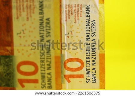 Swiss money, a business background. Swiss banknotes on yellow background. Foto stock © 