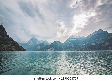 Swiss mountains, lake, sky landscape