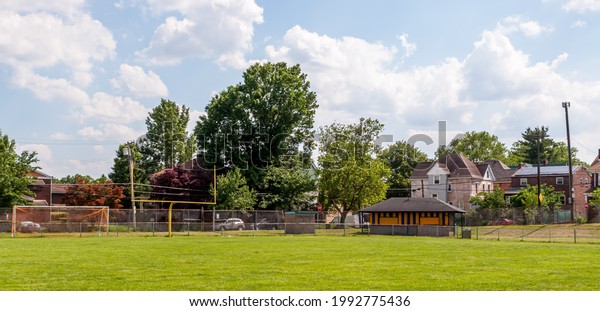 Swissvale,\
Pennsylvania, USA June 5, 2021 A football field with a concession\
stand in the corner on a sunny spring\
day