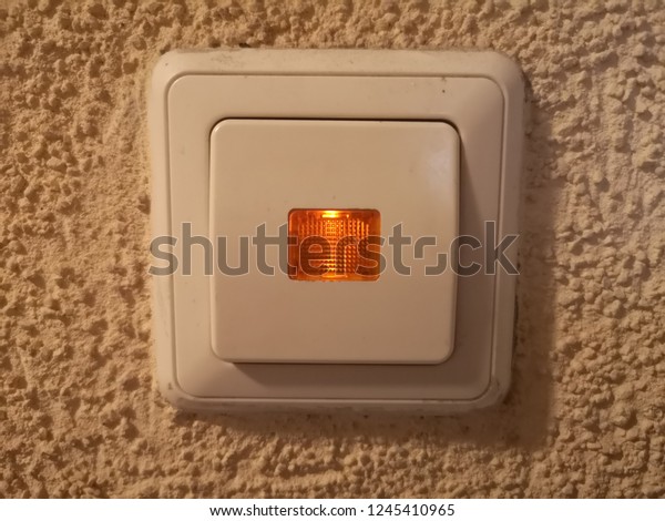 Switch With Indicator\
lighting for delay on-off and indicated switch icon position on the\
concrete wall.