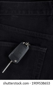 Switch key is lying in back pocket of black pants.