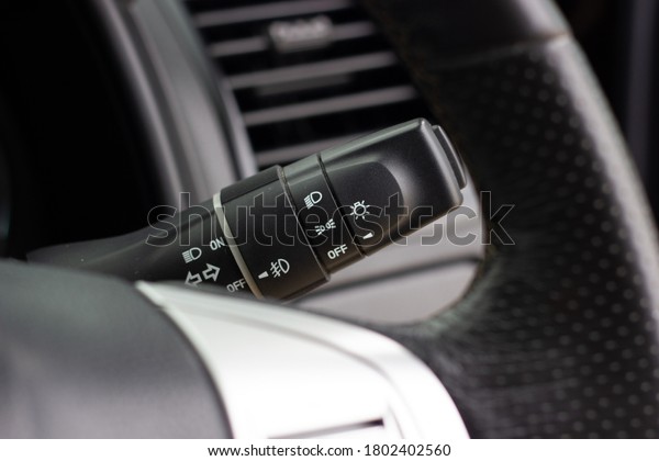 Switch off lights in a car.
close-up Car integrated turning indicator with headlight switch
toggle.