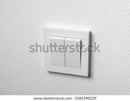 Switch on or off button on white wall. Closeup
