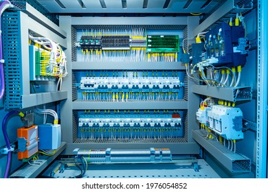 Switchboard equipment. Shield for enterprise automation. Concept - equipment for automation of equipment at enterprise. Panel with wires and switches at enterprise. Automation of production.