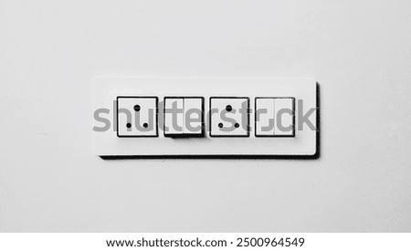 A switchboard with multiple switches on a clean background, highlighting it's functional and practical design. Perfect use in electrical, home improvement, and interior design content.