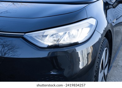 Switched on led lights of luxury car. Car front led Light. Modern car headlamp flashing light with blinking on continuously indicator. Car Blinker Light