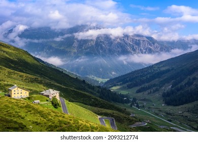 SPLÜGEN, SWITZERLAND - AUGUST 19, 2021: Splügen Pass Road With Mountain House Splügen