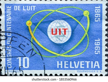 Switzerland - Circa 1965 : A Postage Stamp Printed In The Swiss Showing Aa Symbolic Representation Of The Telecommunications System Text: Anniversary Of The International Telecommunication Union (UIT)