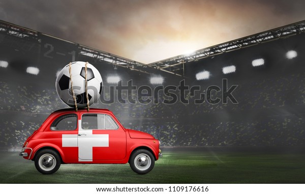 Switzerland flag on car delivering soccer or\
football ball at\
stadium