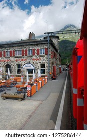Switzerland, July 2012: Alp Grum Station of famous red alpine train Bernina Express in Switzerland.