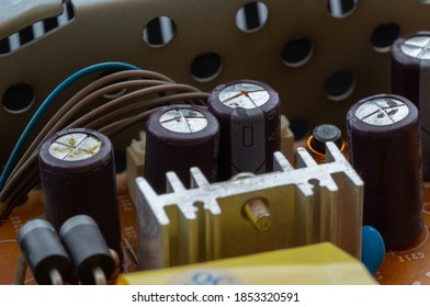 Swollen Dry Capacitors. Non-working Microcircuit Elements Requiring Replacement.