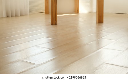 Swollen Laminate Flooring From Flood Or Water Damage, Perspective View. Living Room With Beige Laminate Boards With Buckling Edge Pieces. Floor Damage Texture. Selective Focus In Center.