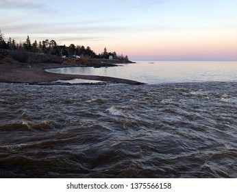 Swollen With Melting Snow, The Lester River Rushes To Meet Lake Superior At The North End Of Duluth, Minnesota.