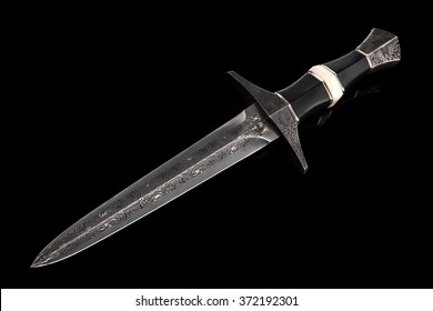the sword of Damascus steel on the black background