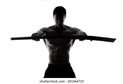 Sword. Silhouette of strong man with sword.Isolated