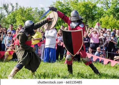 The swordfight heavily armed medieval warriors / The picture was taken in Russia, in Orenburg, at the festival of historical reconstruction "Fighting glory. Phoenix - the wheel of life". 06/10/2017