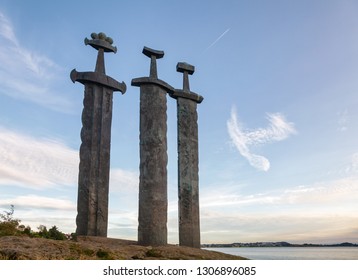 Swords in Rock (Sverd i fjell), three large bronze swords planted into the rock in Mollebukta bay, monument commemorating the Battle of Hafrsfjord in 872 united Norway, Stavanger, Rogaland, Norway