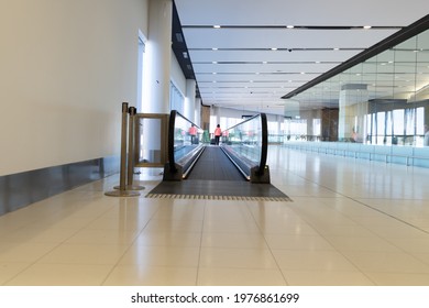 Sydney Australia 17 May 2021 Covid 19 Pandemic Illustrative Editorial Content Empty Airport Terminal Walkway With Solitary Passenger Walking Towards Boarding Gate