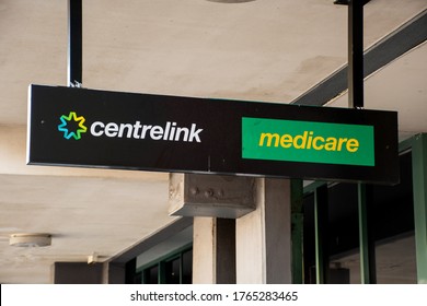 Sydney, Australia - 2019-12-24 Medicare And Centrlink Sign Outside Of A Building. Centrelink Is An Australian Government Agency That Administers Medicare And Disability Insurance Scheme