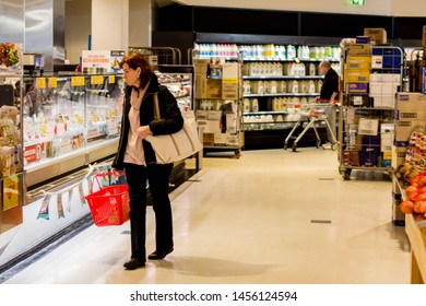 Sydney / Australia 2019-19-07 A Woman Surveying Deli Aisle At Coles Supermarket