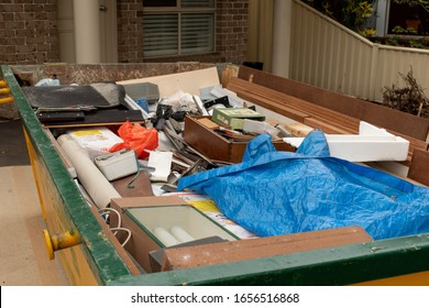 Sydney, Australia 2020-02-15 Skip Bin Full Of Household Waste Rubbish On The Front Yard. House Clean Up Concept