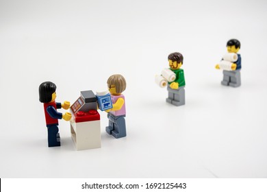 Sydney, Australia - 2020-03-23 Coronavirus social distancing concept. Minifigures staying in line at the supermarket trying to keep the distance. - Shutterstock ID 1692125443