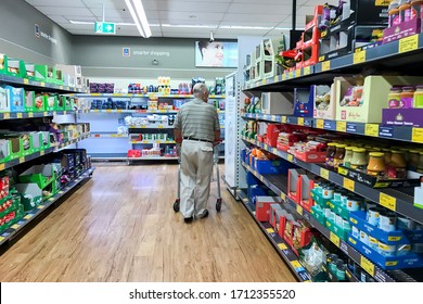 Sydney, Australia 2020-04-22 A Senior Man Wearing Mask Surveying Grocery Aisle At ALDI Supermarket During Coronavirus Pandemic