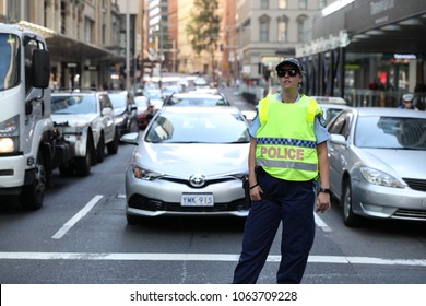 Sydney Australia 8 April 2018 — Protest For Palestine In Sydney CBD. A Police Woman Guards Traffic From Protestors Passing Road