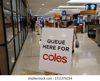 Sydney, Australia Apr 13 2020: Social Distancing Notice Sign At Coles Supermarket Telling Shopper To Stand Apart For At Least 1.5 M And Queue To Enter To Stop Spread Of COVID-19 Virus Global Pandemic