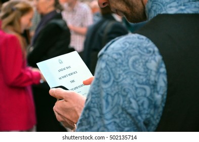 Sydney, Australia - April 25, 2013. Man Helds The Program Of ANZAC Day Sunset Service At Martin Place. 