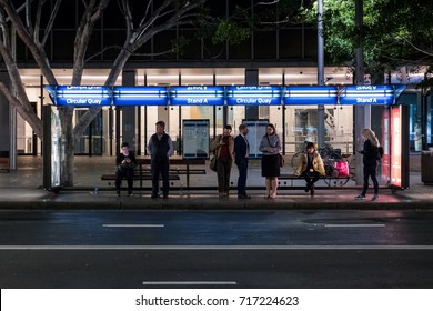 SYDNEY, AUSTRALIA - AUGUST 1, 2017: People Waiting For Bus At Circular Quay Bus Stop At Night