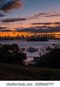 Sydney, Australia - August 13, 2022: A Party Boat In Sydney Harbour With City Skyline In The Background.