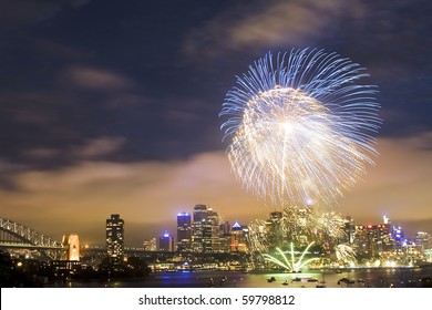 Sydney Australia CBD Night Scene New Year Fireworks Celebration Pyrotechnics Ball High In Dark Sky Color Illumination