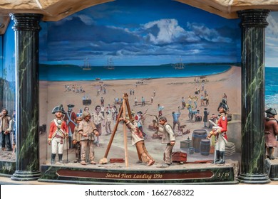 Sydney, Australia - December 11, 2009: Inside Queen Victoria Building Shopping Mall. Closeup Of Second-fleet-landing Painting And Puppets Set In Giant Clock Contraption. Blue Sky, Beige Sand, And Peop