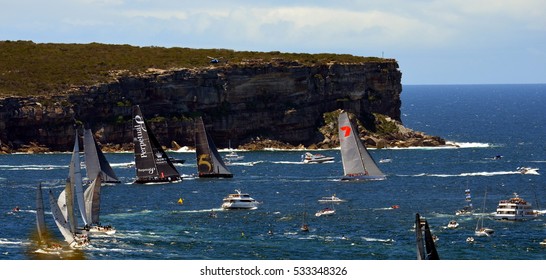 Sydney, Australia - December 26, 2013. Wild Oats leading and approaching North Head. The Sydney to Hobart Yacht Race is an annual event, starting in Sydney on Boxing Day and finishing in Hobart.