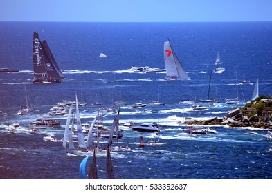 Sydney, Australia - December 26, 2013. While Wild Oats already on open water, last yachts just turning to Tasman Sea. Sydney to Hobart Yacht Race on Boxing day.