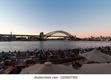 Sydney, Australia - December 29, 2021: Crown Of People At Circular Quay With Harbour Bridge On The Background.