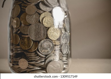 SYDNEY, AUSTRALIA - February 11, 2018: A Saving Jar Full With Coins In Australian Dollar Currency