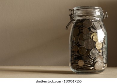 SYDNEY, AUSTRALIA - February 11, 2018: A Saving Jar Full With Coins In Australian Dollar Currency