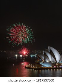 Sydney, Australia - February 13, 2021: Red And Green Fireworks Display Next To Sydney Opera House.