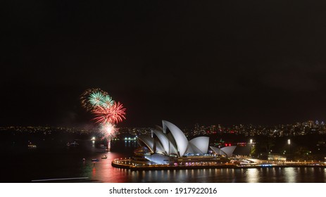 Sydney, Australia - February 13, 2021: Red And Green Fireworks Display Next To Sydney Opera House.