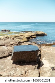 Sydney, Australia - Jan 2020: Art Sculpture Exhibition On Bondi Beach Coastal Walk. Melting Statue Of Liberty Concept. Gold Dramatic Artwork.