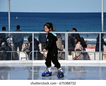 Sydney, Australia - Jul 9,, 2017. Little Asian Girl Ice Skating On Bondi Ice Rink. Australia's Only Beachside Ice Rink Is On Bondi Beach During Winter Festival.