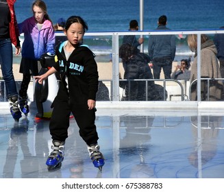 Sydney, Australia - Jul 9,, 2017. Little Asian Girl Ice Skating On Bondi Ice Rink. Australia's Only Beachside Ice Rink Is On Bondi Beach During Winter Festival.