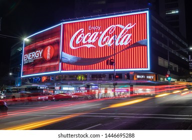 SYDNEY, AUSTRALIA - JULY 1st, 2019: The Refurbished Coca Cola Sign On Kings Cross, Sydney Together With An Ad For The New Coke Energy Drink.