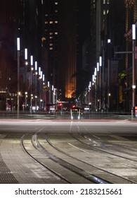 Sydney, Australia - July 22, 2022: George Street View At Night With Tram And Car Passing Through.